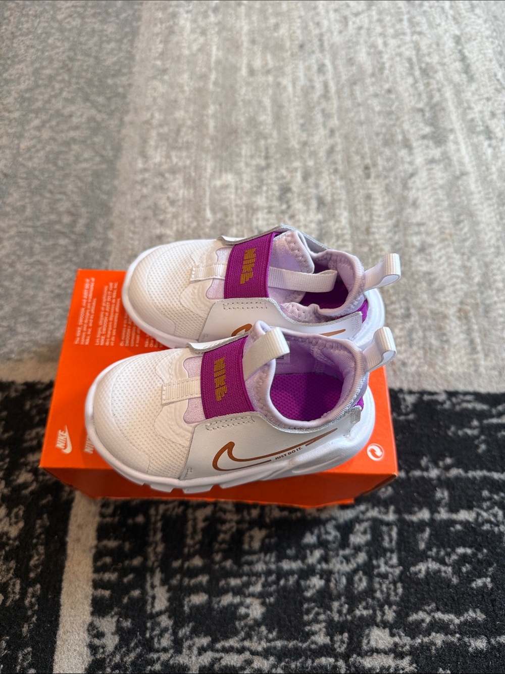 Nike Kids White Sneakers with Purple and Gold Accents